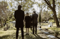 a person bringing flowers when attending a funeral and cremation in Tacoma, WA